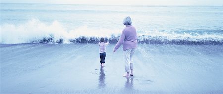simsearch:700-00046927,k - Back View of Great Grandmother And Granddaughter in Surf Stock Photo - Rights-Managed, Code: 700-00062714