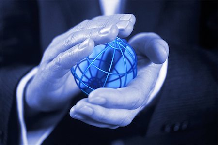 simsearch:700-00362048,k - Close-Up of Businessman's Hands Holding Wire Globe Stock Photo - Rights-Managed, Code: 700-00074529