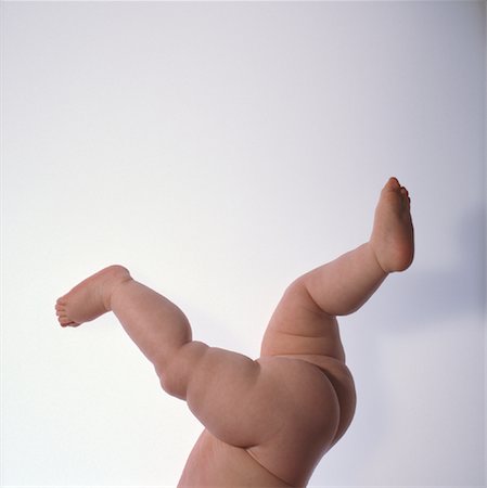 Nude Baby's Legs and Feet Kicking Foto de stock - Con derechos protegidos, Código: 700-00074902