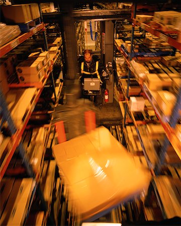 simsearch:700-00034776,k - Man Operating Forklift in Warehouse Stock Photo - Rights-Managed, Code: 700-00075258