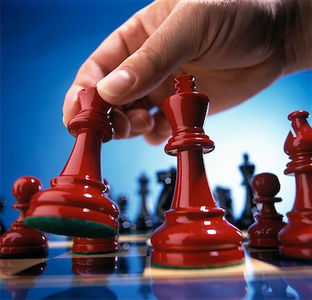 simsearch:700-00075674,k - Close-Up of Hand Moving Chess Piece Stock Photo - Rights-Managed, Code: 700-00075674