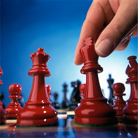 simsearch:700-00075674,k - Close-Up of Hand Moving Chess Piece Stock Photo - Rights-Managed, Code: 700-00075673