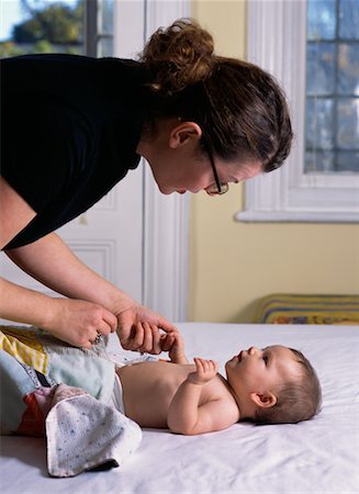 Mother Changing Baby's Clothes Stock Photo - Rights-Managed, Code: 700-00075740