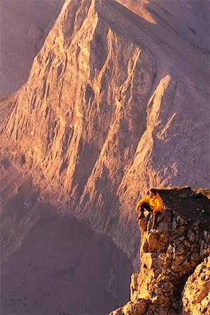 Mountain Climber on Rock near Canadian Rockies at Sunrise Canmore, Alberta, Canada Stock Photo - Rights-Managed, Code: 700-00075866