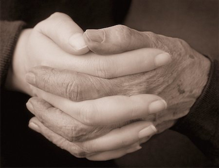 Close-Up of Young and Old Hands Clasped Together Stock Photo - Rights-Managed, Code: 700-00076393