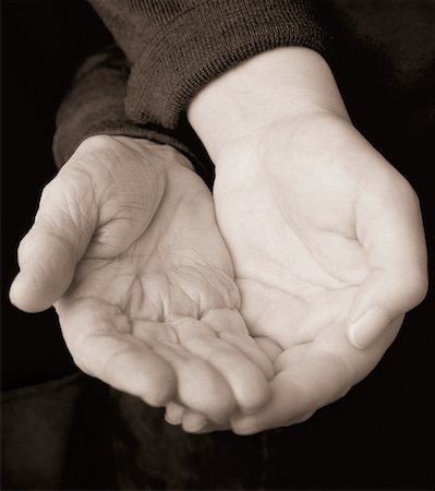 Close-Up of Young and Old Hands Cupped Together Stock Photo - Rights-Managed, Code: 700-00076725