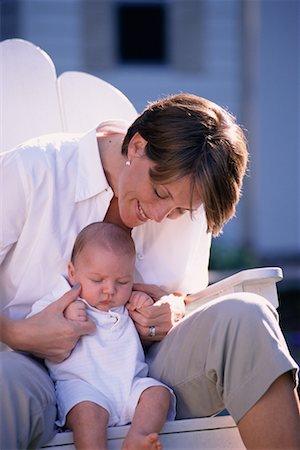 simsearch:700-00080994,k - Mother Sitting in Chair with Baby Outdoors Stock Photo - Rights-Managed, Code: 700-00077771