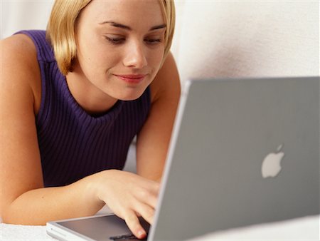 simsearch:700-00083403,k - Woman Lying on Sofa, Using Laptop Computer Stock Photo - Rights-Managed, Code: 700-00077857
