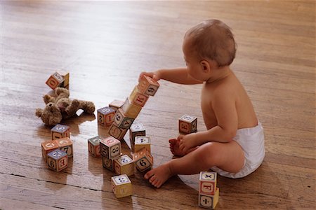 Baby Sitting on Floor, Playing With Blocks Stock Photo - Rights-Managed, Code: 700-00078650