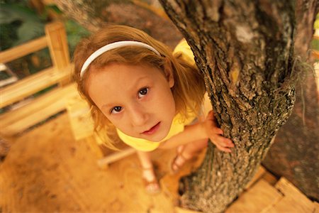 Portrait of Girl Leaning on Tree Stock Photo - Rights-Managed, Code: 700-00078772