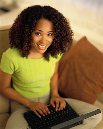 simsearch:700-00083403,k - Portrait of Woman Sitting on Sofa Using Laptop Computer, Smiling Stock Photo - Rights-Managed, Code: 700-00079763