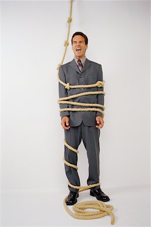 simsearch:700-00088934,k - Businessman Tied with Knotted Rope, Yelling Stock Photo - Rights-Managed, Code: 700-00070816