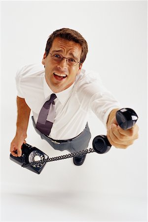 simsearch:700-00088934,k - Overhead View of Businessman Holding Rotary Phone Stock Photo - Rights-Managed, Code: 700-00070835