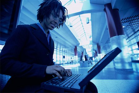simsearch:700-00083403,k - Businesswoman Using Laptop in Terminal Stock Photo - Rights-Managed, Code: 700-00071151