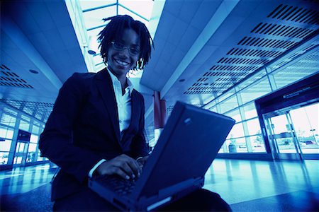simsearch:700-00083403,k - Portrait of Businesswoman with Laptop in Terminal Stock Photo - Rights-Managed, Code: 700-00071152
