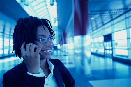 simsearch:700-00189516,k - Businesswoman Using Cell Phone in Terminal, Smiling Stock Photo - Rights-Managed, Code: 700-00071191