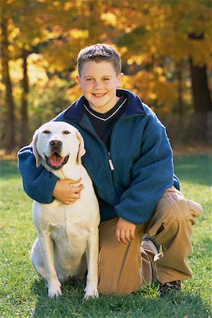 simsearch:700-00071488,k - Portrait of Boy with Dog Outdoors In Autumn Stock Photo - Rights-Managed, Code: 700-00071485