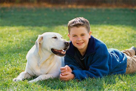 simsearch:700-00071488,k - Portrait of Boy Lying in Field With Dog in Autumn Stock Photo - Rights-Managed, Code: 700-00071486