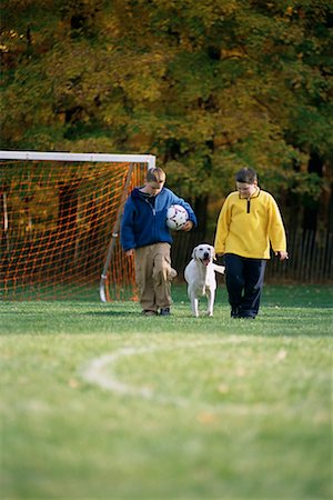 simsearch:700-00071488,k - Two Boys Walking through Field With Soccer Ball and Dog in Autumn Stock Photo - Rights-Managed, Code: 700-00071494