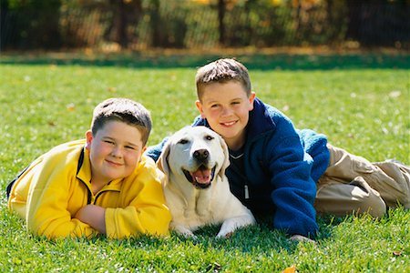simsearch:700-00071488,k - Portrait of Two Boys Lying in Field with Dog in Autumn Stock Photo - Rights-Managed, Code: 700-00071490