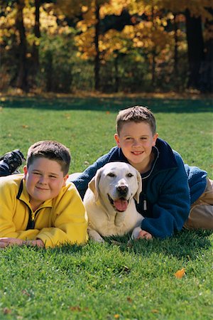 simsearch:700-00071488,k - Portrait of Two Boys Lying in Field with Dog in Autumn Stock Photo - Rights-Managed, Code: 700-00071491