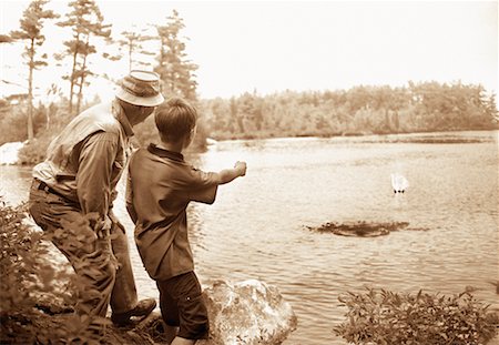 skipping stones on water - Grandfather and Grandson Skipping Stones into Lake, Belgrade Lakes Maine, USA Stock Photo - Rights-Managed, Code: 700-00072280