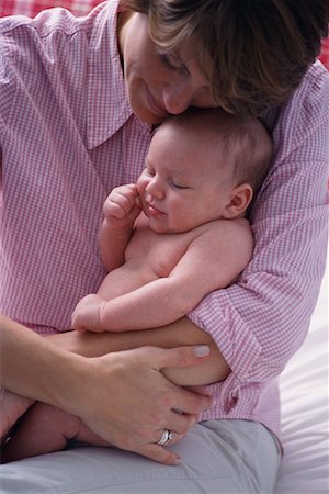 simsearch:700-00080994,k - Mother Sitting on Bed, Holding Baby Stock Photo - Rights-Managed, Code: 700-00072528