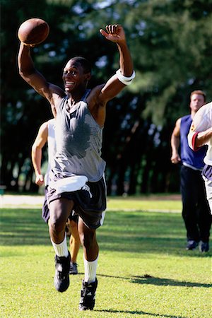 Men Playing Football, Celebrating Stock Photo - Rights-Managed, Code: 700-00072572