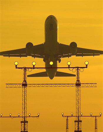 simsearch:700-05641925,k - Looking Up at Airplane Taking Off at Sunset Pearson International Airport Toronto, Ontario, Canada Stock Photo - Rights-Managed, Code: 700-00073307