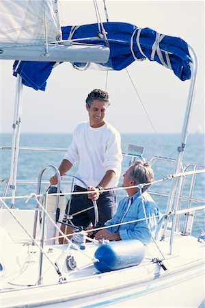 simsearch:700-00031838,k - Two Mature Men Talking on Sailboat Stock Photo - Rights-Managed, Code: 700-00084175