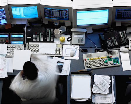 simsearch:700-00641415,k - Overhead View of Man at Desk in Financial Trading Room Stock Photo - Rights-Managed, Code: 700-00084280