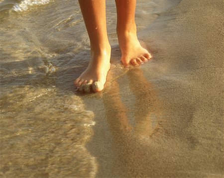simsearch:700-00085279,k - Close-Up of Woman's Feet in Surf On Beach Stock Photo - Rights-Managed, Code: 700-00085279