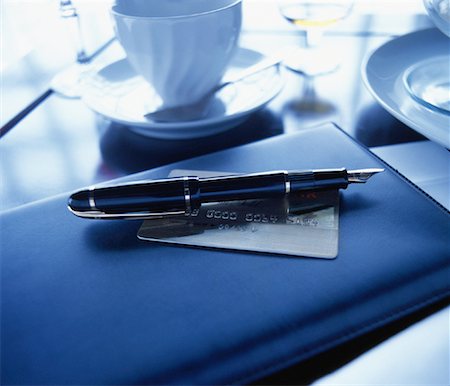 simsearch:700-00085293,k - Fountain Pen, Credit Card and Bill Holder on Restaurant Table Stock Photo - Rights-Managed, Code: 700-00085293