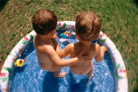 simsearch:700-00280017,k - Back View of Two Nude Children Standing in Inflatable Swimming Pool Stock Photo - Rights-Managed, Code: 700-00085424