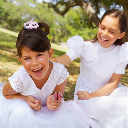 simsearch:700-00085631,k - Two Girls Wearing Dresses Playing with Toy Butterfly Outdoors Stock Photo - Rights-Managed, Code: 700-00085632