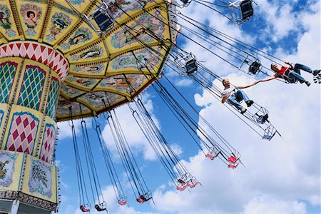 Couple on Swing Ride at Amusement Park Stock Photo - Rights-Managed, Code: 700-00085773