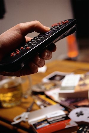 simsearch:700-00284729,k - Close-Up of Hand Holding Television Remote Control Stock Photo - Rights-Managed, Code: 700-00086133