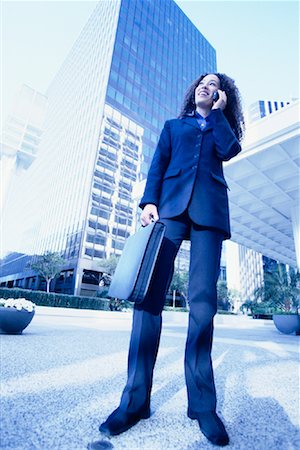simsearch:700-00189516,k - Businesswoman Standing Outdoors Using Cell Phone Stock Photo - Rights-Managed, Code: 700-00086269