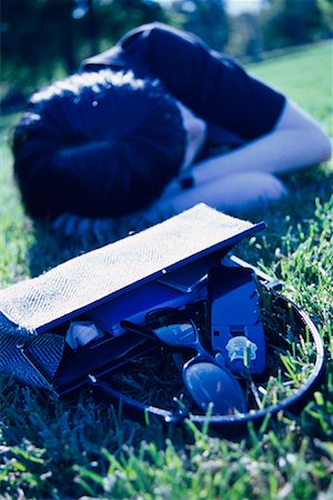simsearch:700-00522867,k - Woman Lying on Grass with Purse Cell Phone and Sunglasses Stock Photo - Rights-Managed, Code: 700-00086359
