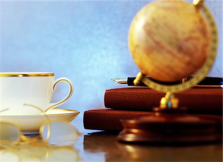 Cup, Globe, Eyeglasses, Notebooks and Fountain Pen Stock Photo - Rights-Managed, Code: 700-00089798