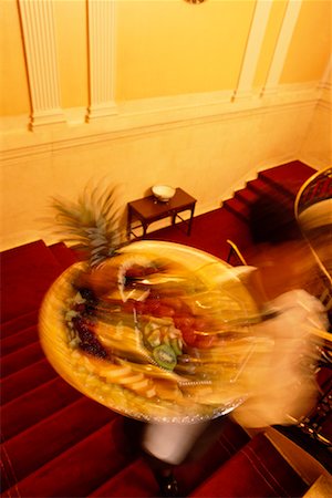 Blurred View of Hotel Personnel Carrying Tray of Food for Room Service Stock Photo - Rights-Managed, Code: 700-00082879