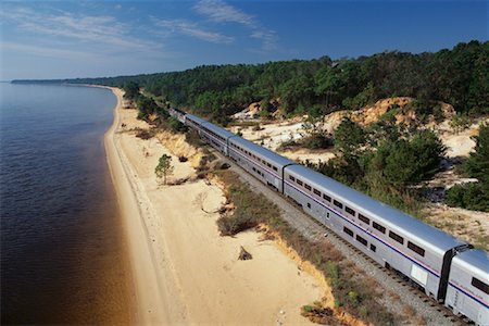 simsearch:700-00082926,k - Passenger Train by Shoreline and Trees Near Pensacola, Florida, USA Stock Photo - Rights-Managed, Code: 700-00082924