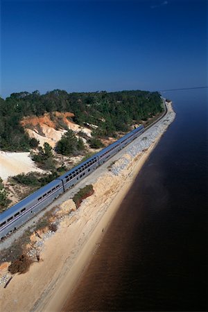 simsearch:700-00082926,k - Passenger Train by Shoreline and Trees Near Pensacola, Florida, USA Stock Photo - Rights-Managed, Code: 700-00082926