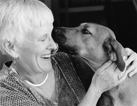 dogs licking woman - Dog Licking Mature Woman on Face Stock Photo - Rights-Managed, Code: 700-00083114