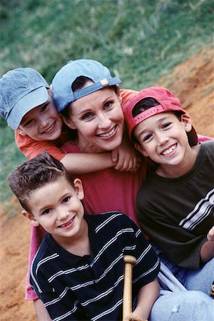 Portrait of Mother and Children With Baseball Bat Outdoors Stock Photo - Rights-Managed, Code: 700-00083591