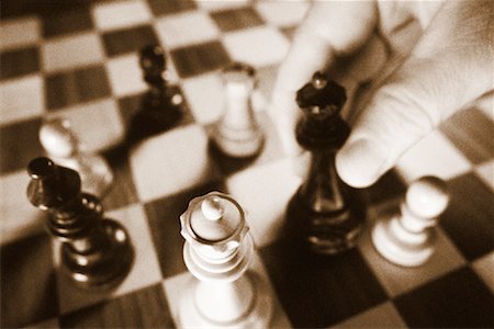 simsearch:700-00075674,k - Close-Up of Hand Moving Chess Piece Stock Photo - Rights-Managed, Code: 700-00083924