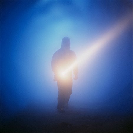 Figure of Person in Foggy Tunnel with Flashlight Stock Photo - Rights-Managed, Code: 700-00083961