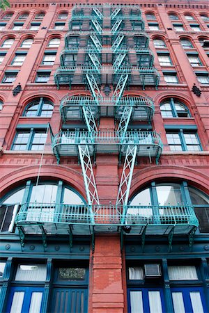 simsearch:700-01694071,k - Fire Escapes on Building Soho, New York, USA Stock Photo - Rights-Managed, Code: 700-00094799