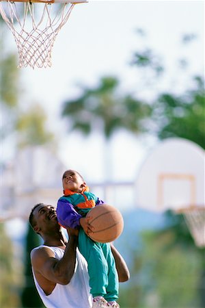 father son basketball - Father and Son Playing Basketball Stock Photo - Rights-Managed, Code: 700-00098230