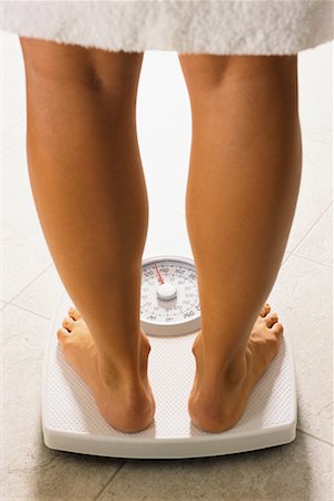 simsearch:600-02245725,k - Close Up of Woman's Legs on Bathroom Scale Stock Photo - Rights-Managed, Code: 700-00154189